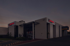 Signbizwa-elastomers-australia-face-lit-illuminated-building-signage-dusk-perth